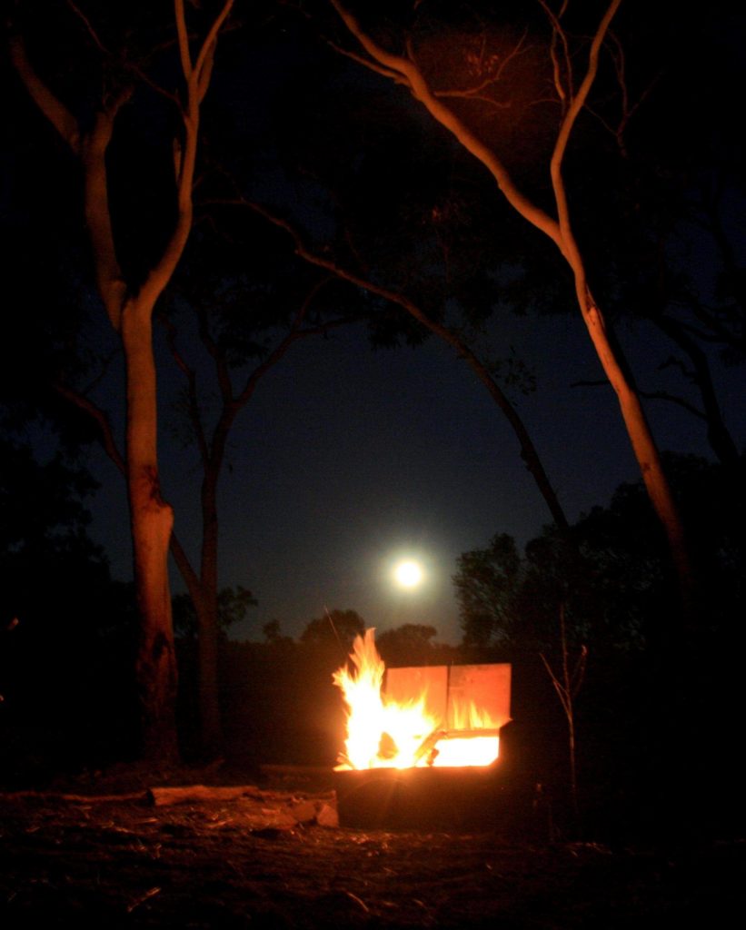 Moon rising over the fire. We decided this was an amazing dinner view.