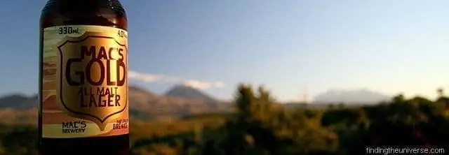 Macs Gold beer bottle with Tongariro National Park in the background