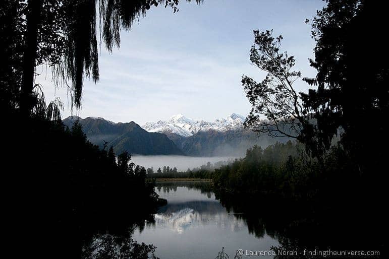 Mirror lake reflection Lake Matheson southern alps New Zealand