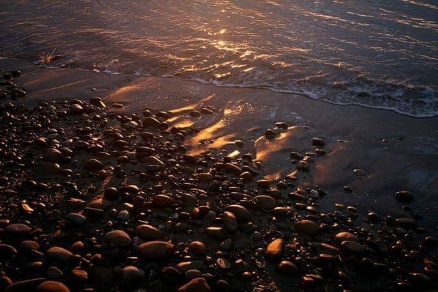 Sunrise beach pebbles