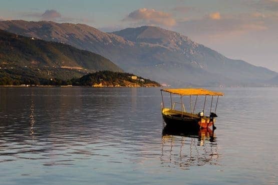 Boat floating on Lake Ohrid at dusk