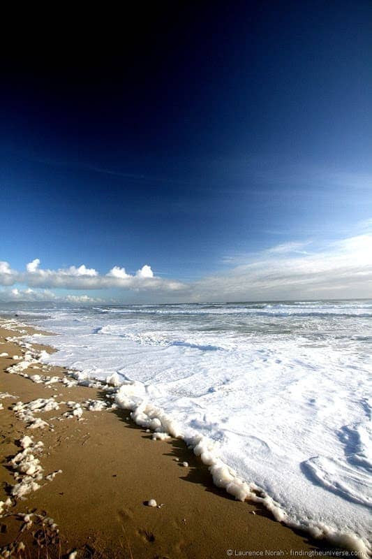 South Island New Zealand - Foamy beach near Karamea