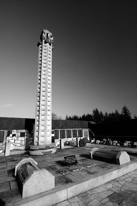 Oradour Sur Glane Graveyard and memorial wall bw