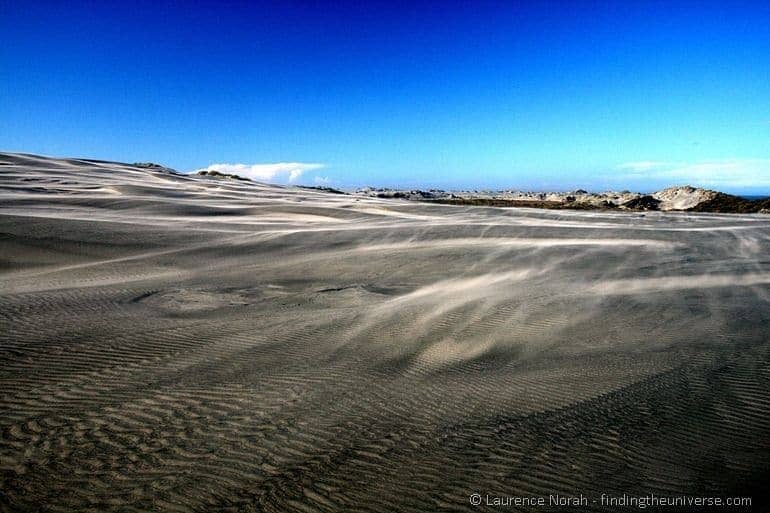 Sand blowing over dunes