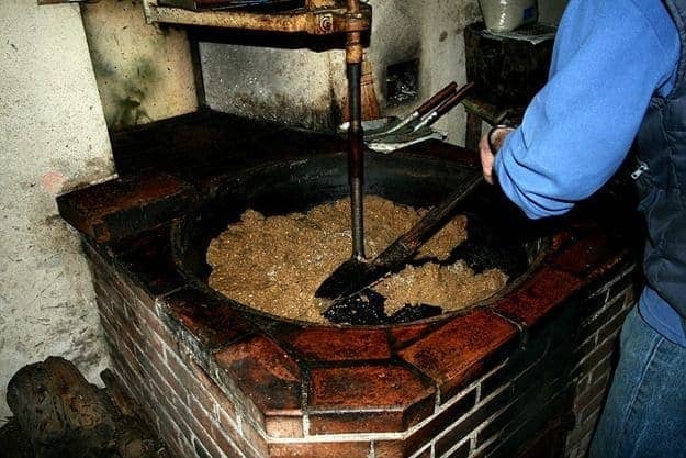 Walnut oil maker stirring