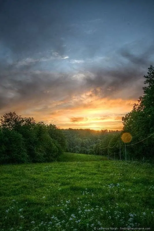 Sunset over grassy field France Sunset over grassy field France