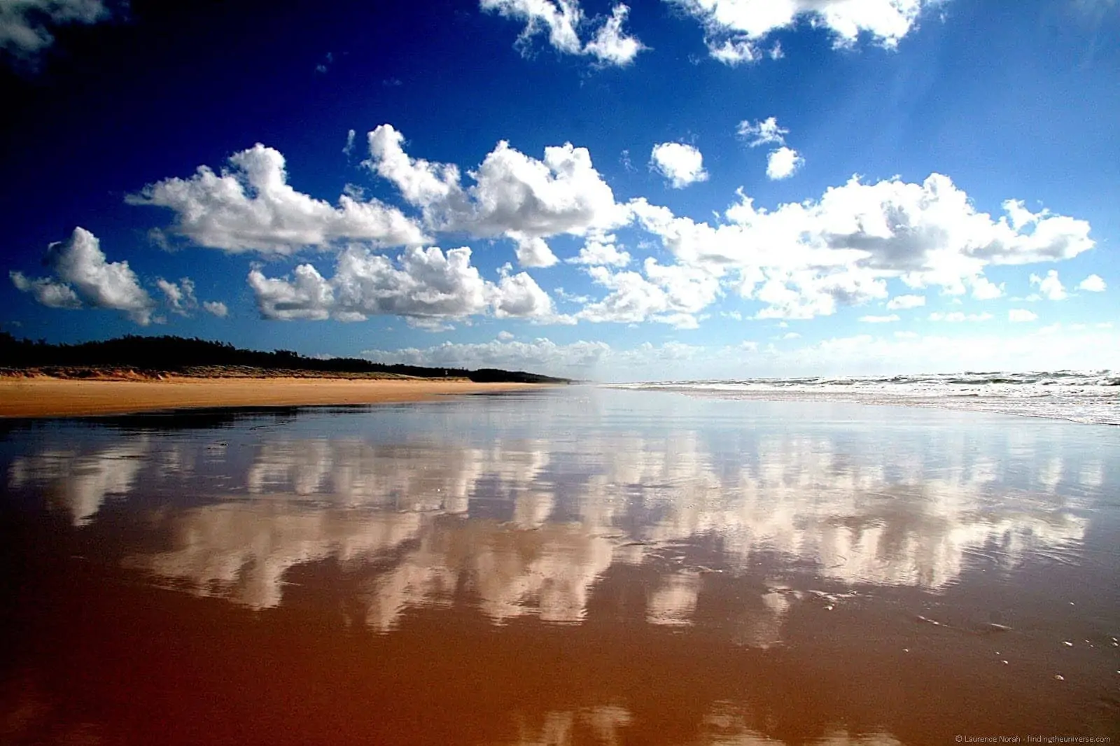 Clouds reflecting in the water on the Fraser island beach - Queensland - Australia