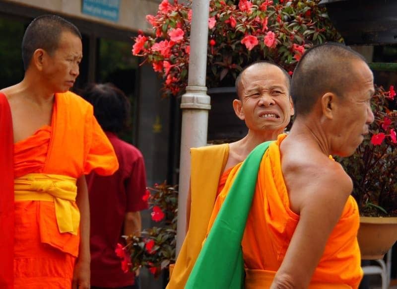 I've captured this Thai monk making a rather strange/quirky looking face 