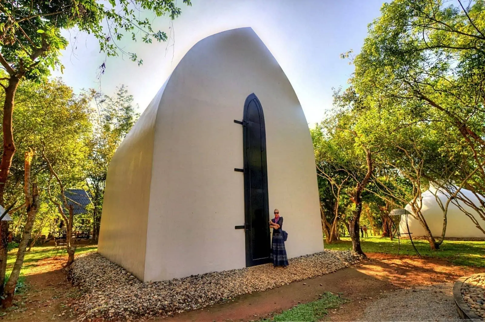 Black House Chiang Rai guest room with a tall doorway