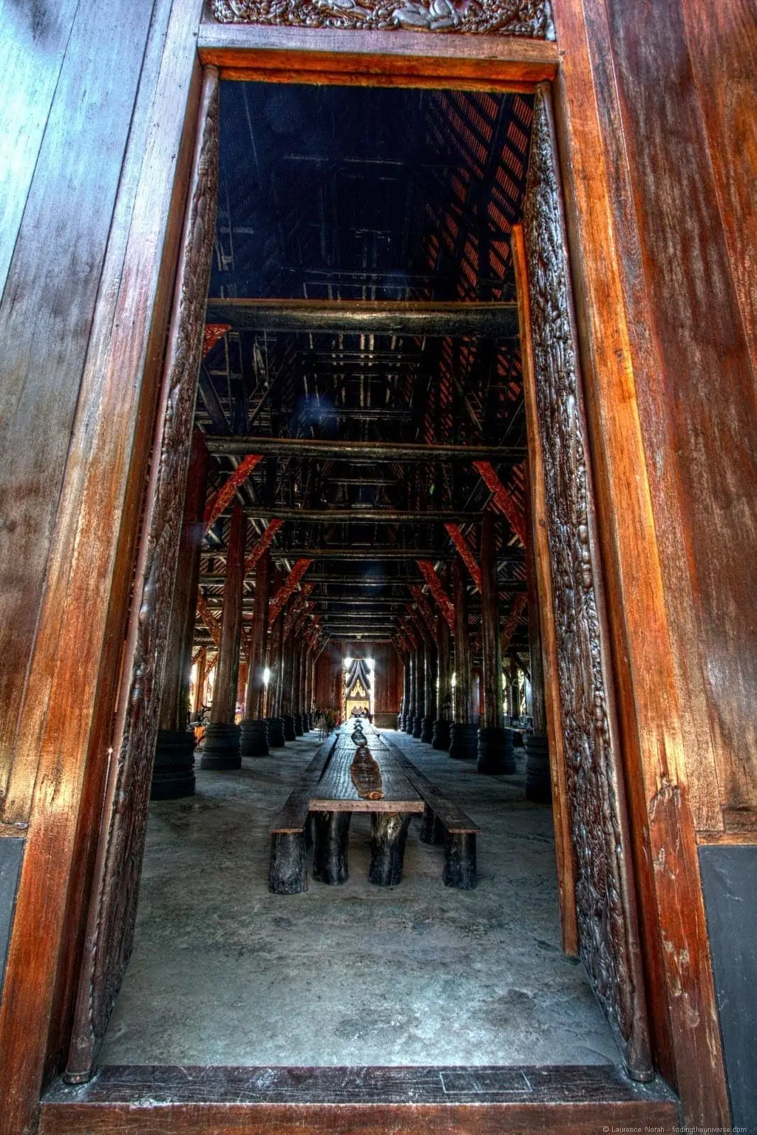 Long table from doorway Black temple Chiang Rai