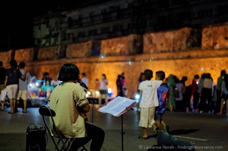 Songkhla night market guitar player city walls