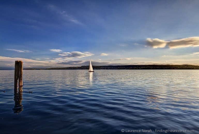 Sunset sailboat reflectiont on the bodensee