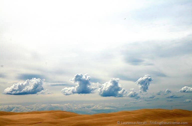 Sand dunes and clouds