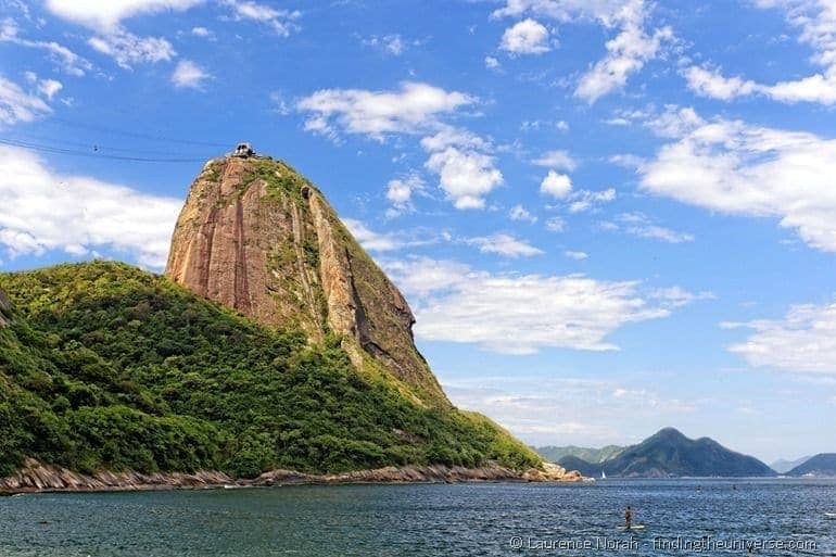 Paddle boarder by Sugarloaf Mountain Rio Brazil