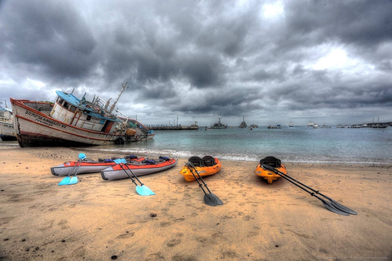 Kayaks on beach san cristobal Galapagos