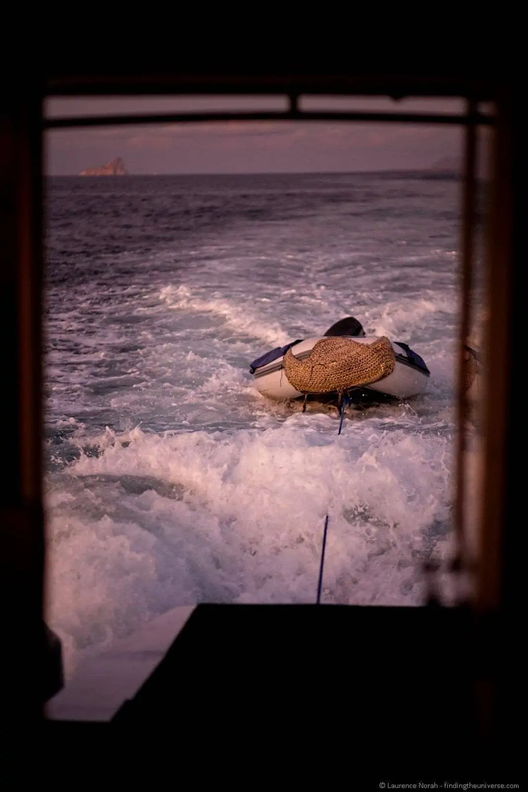 dinghy at sunset with kicker rock Galapagos dinghy at sunset with kicker rock Galapagos
