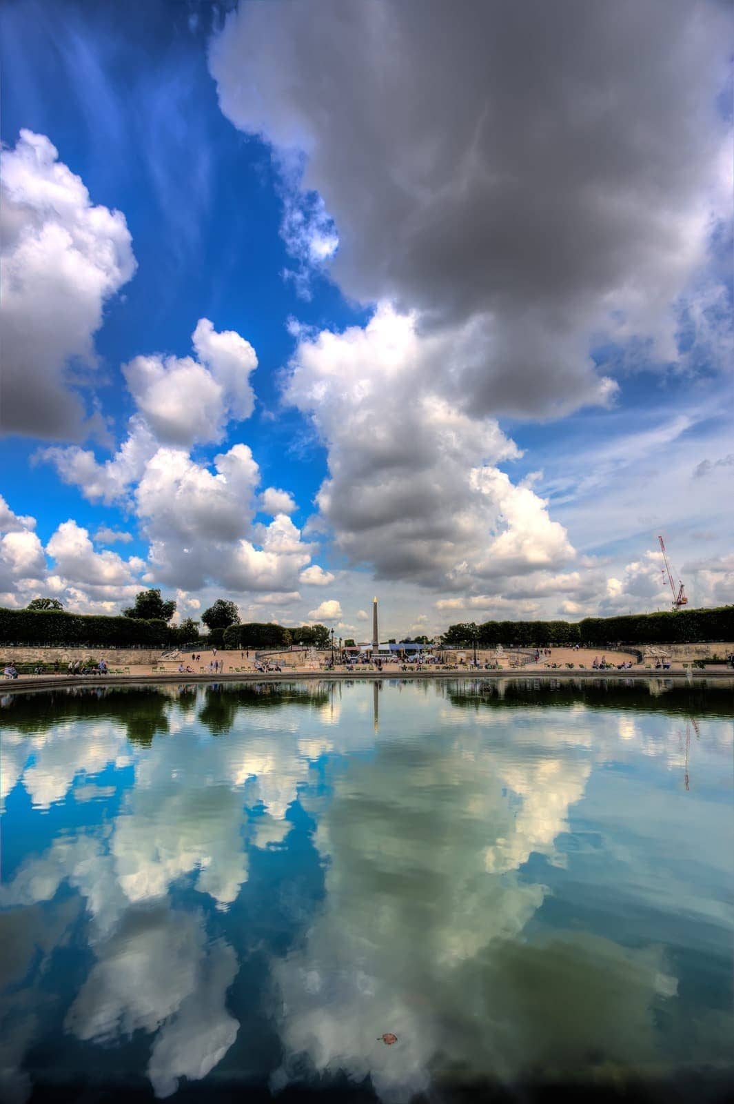 Paris place concorde reflected in tuileries pond