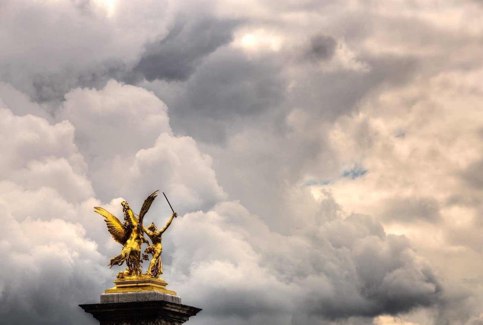 Statue and clouds river seine Paris bridge