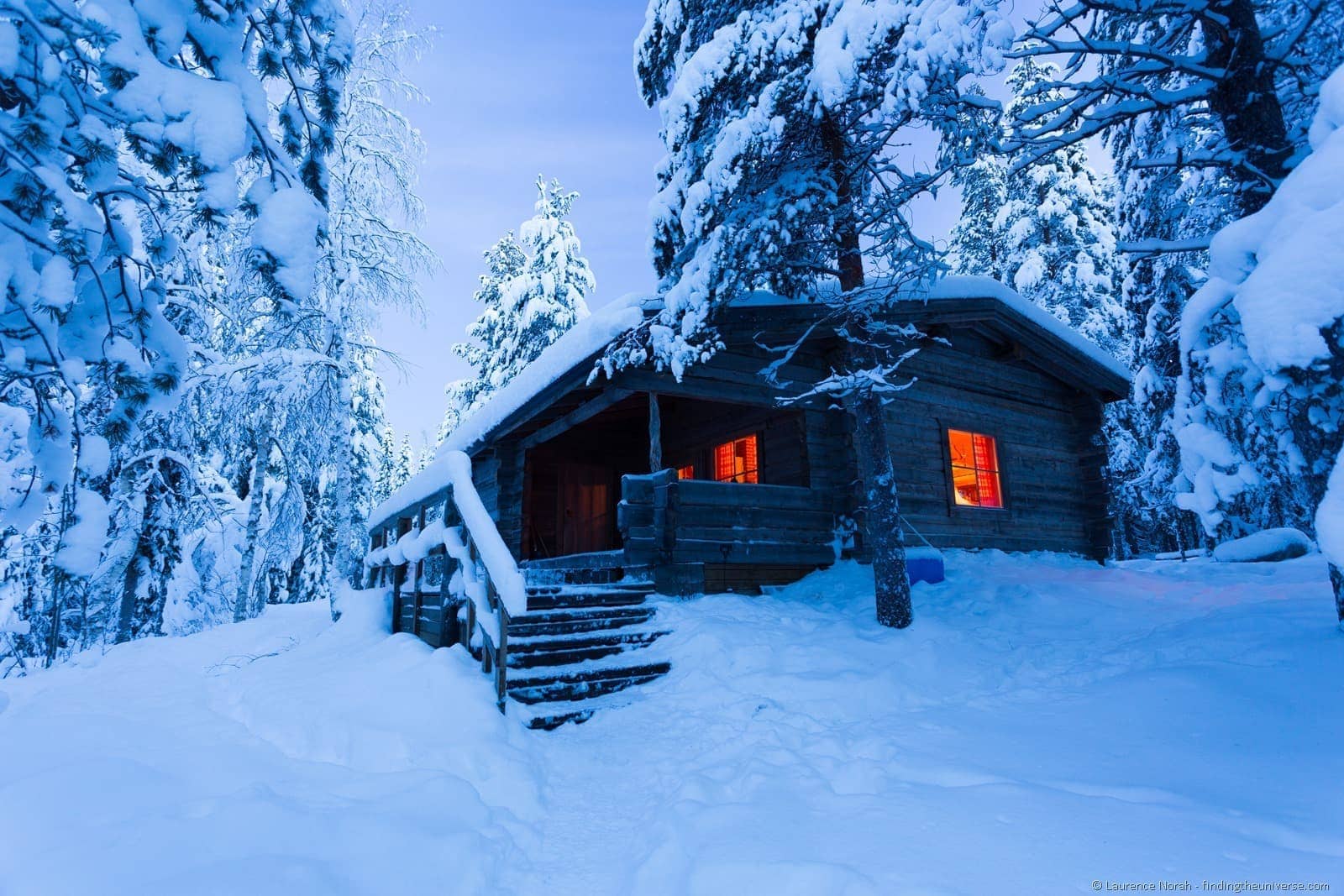 cabin woods snow blue hour