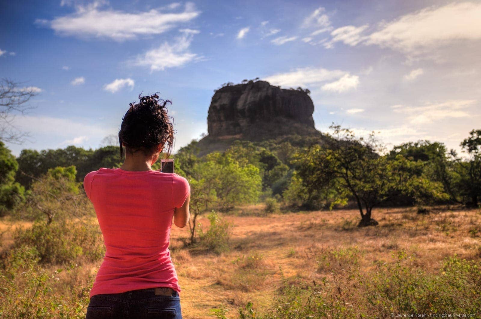 Girl taking photo of Sigiriya Sri Lanka