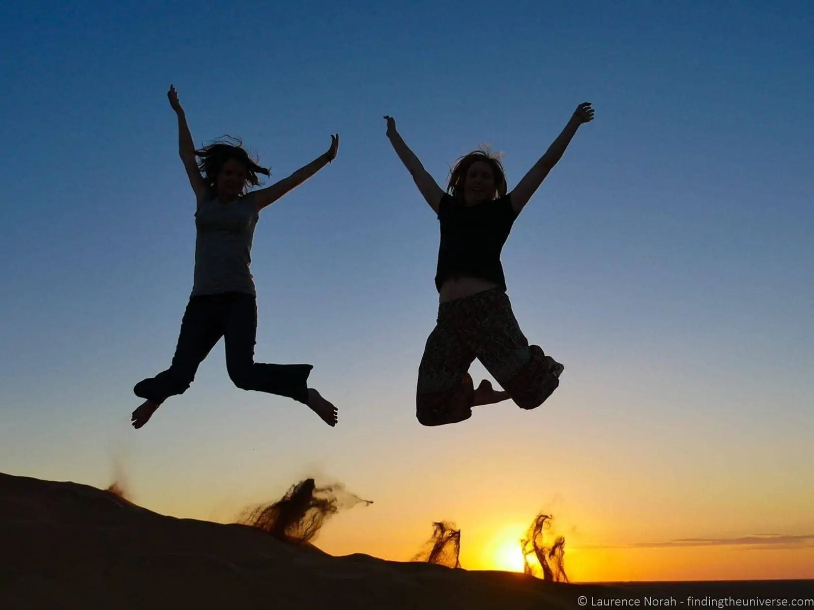 Jumping silhoutte Sahara Morocco Jumping silhoutte Sahara Morocco