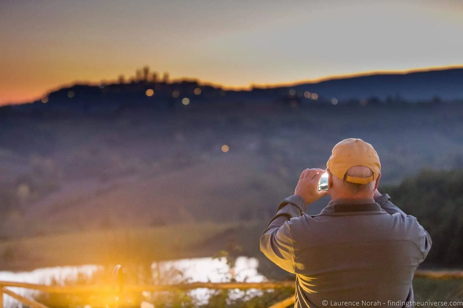 Sunset over San Gimigiano Tuscany man
