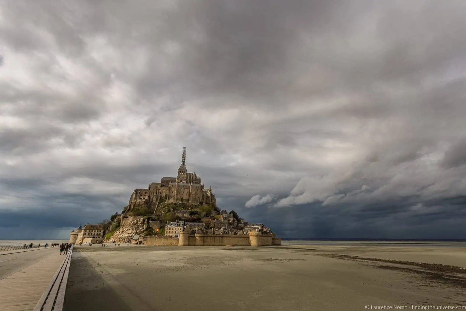 Mont-Saint-Michel under a cloudy Normandy sky