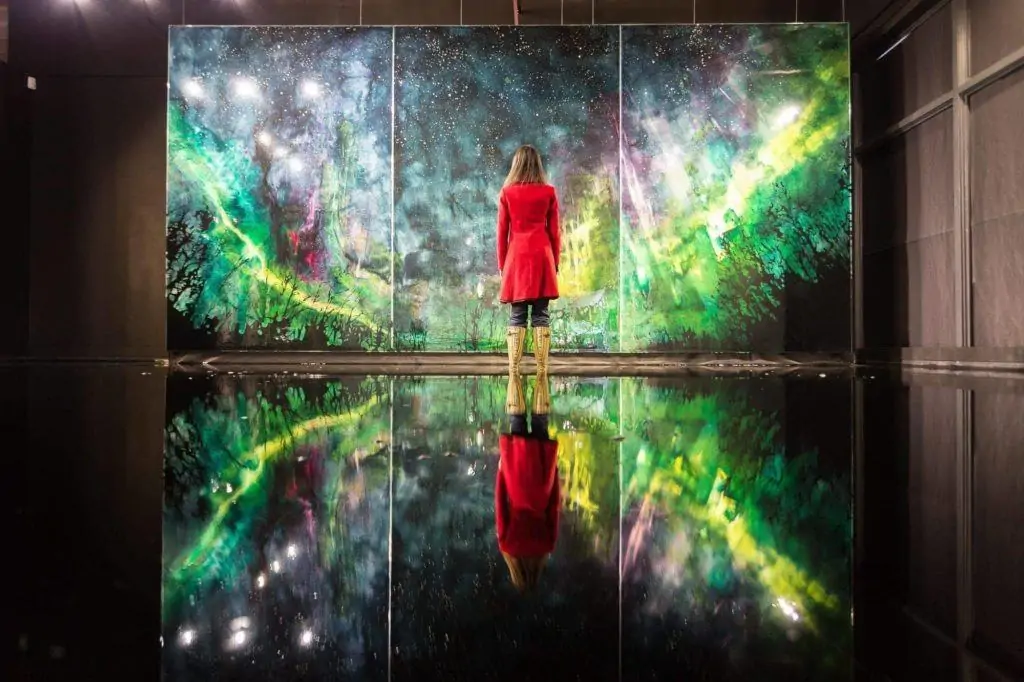 Jess looking at a Steve Driscoll painting at the Peter Robertson Gallery in Edmonton