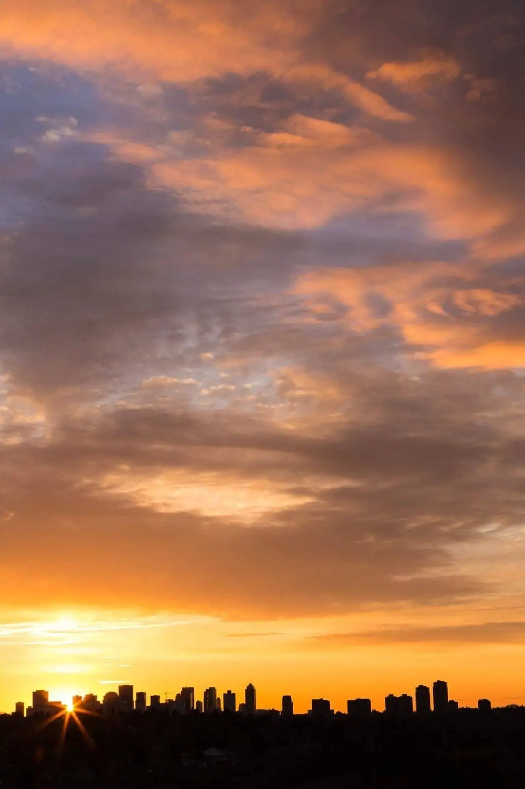 Sunset over the Edmonton skyline from Ada Boulevard