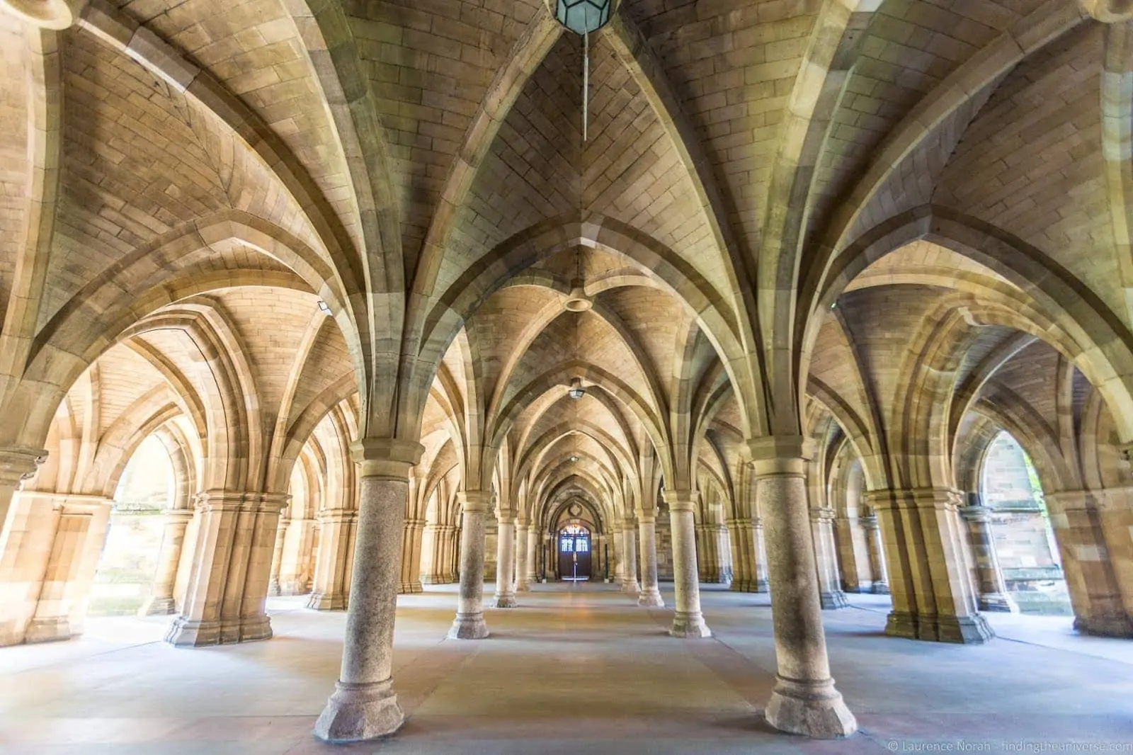The arched stone cloisters beneath the main building of Glasgow University