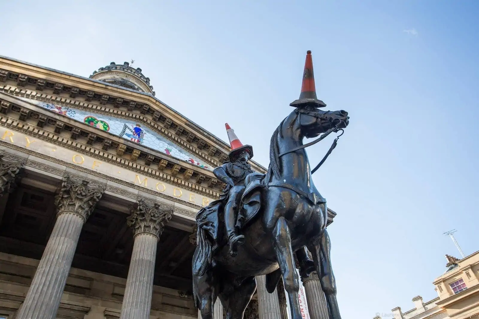 The Duke of Wellington equestrian statue outside Glasgow's Gallery of Modern Art, topped with a traffic cone