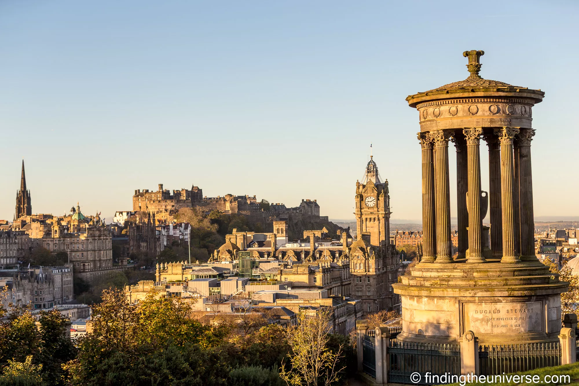 Calton Hill Edinburgh skyline at golden hour with Dugald Stewart Monument and Edinburgh Castle