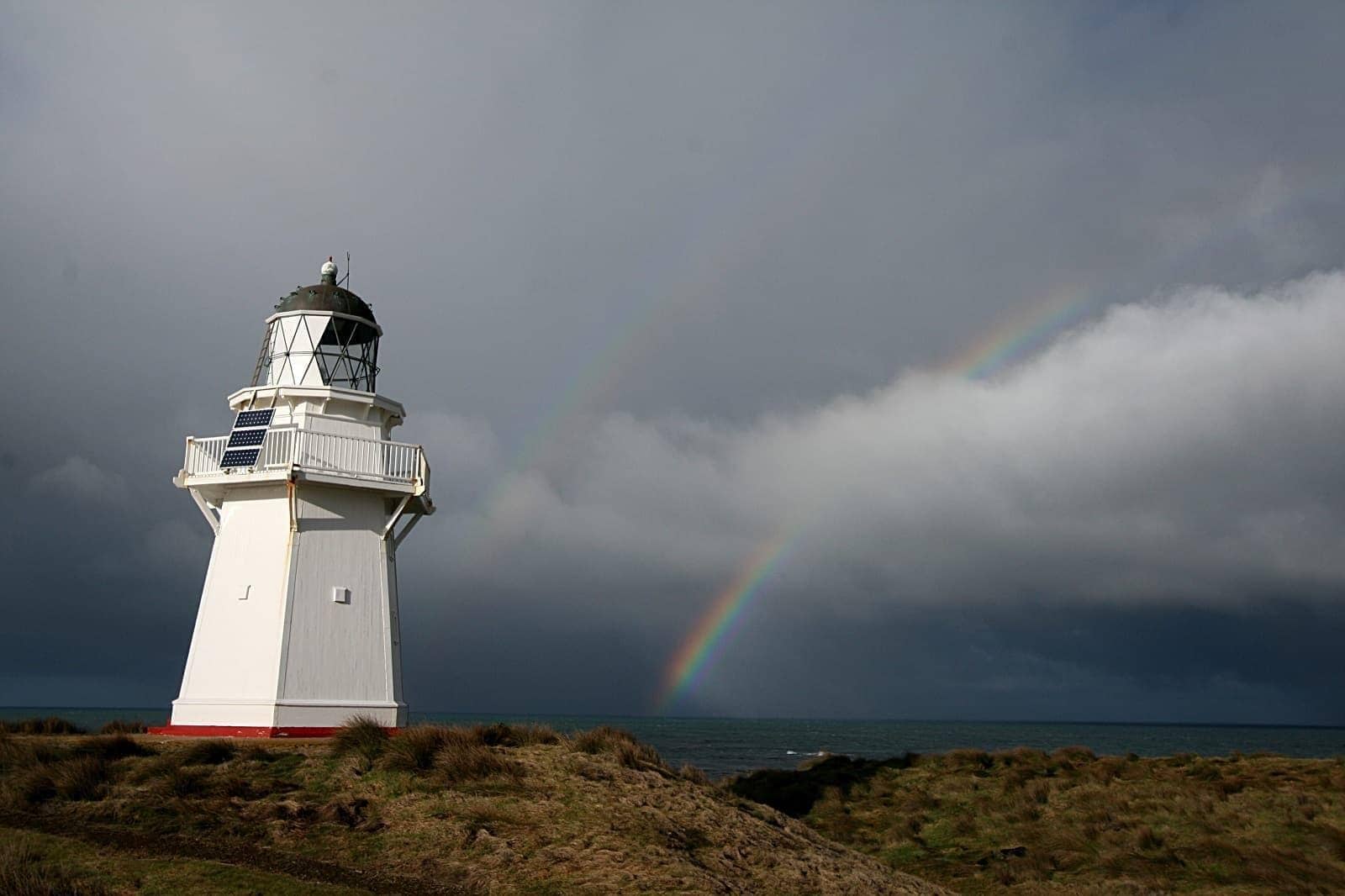 Waipapa Lighthouse double rainbow stormy sky