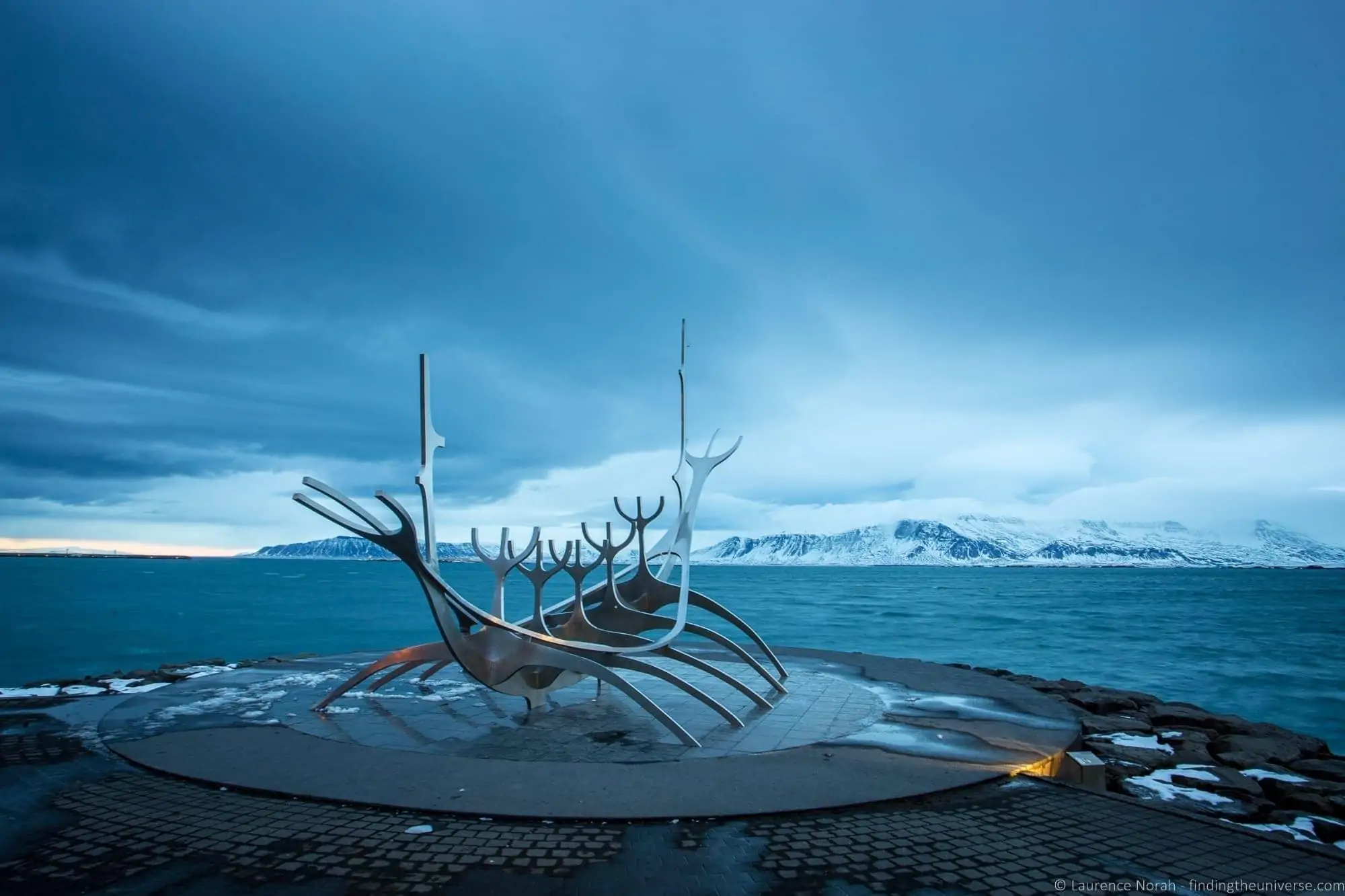 The Sun Voyager sculpture on the Reykjavik waterfront under a blue sky