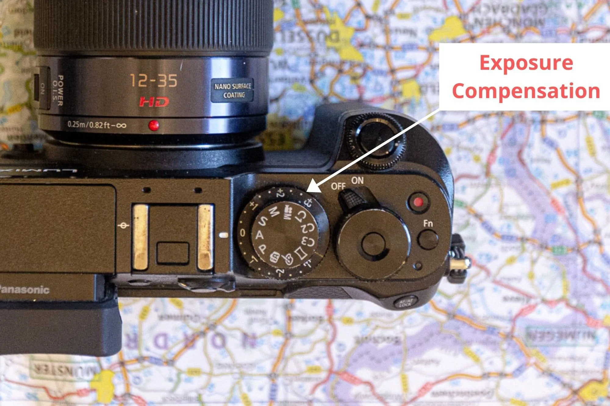 Exposure compensation button on a mirrorless camera