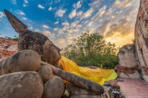 Reclining Buddha at sunset Thailand