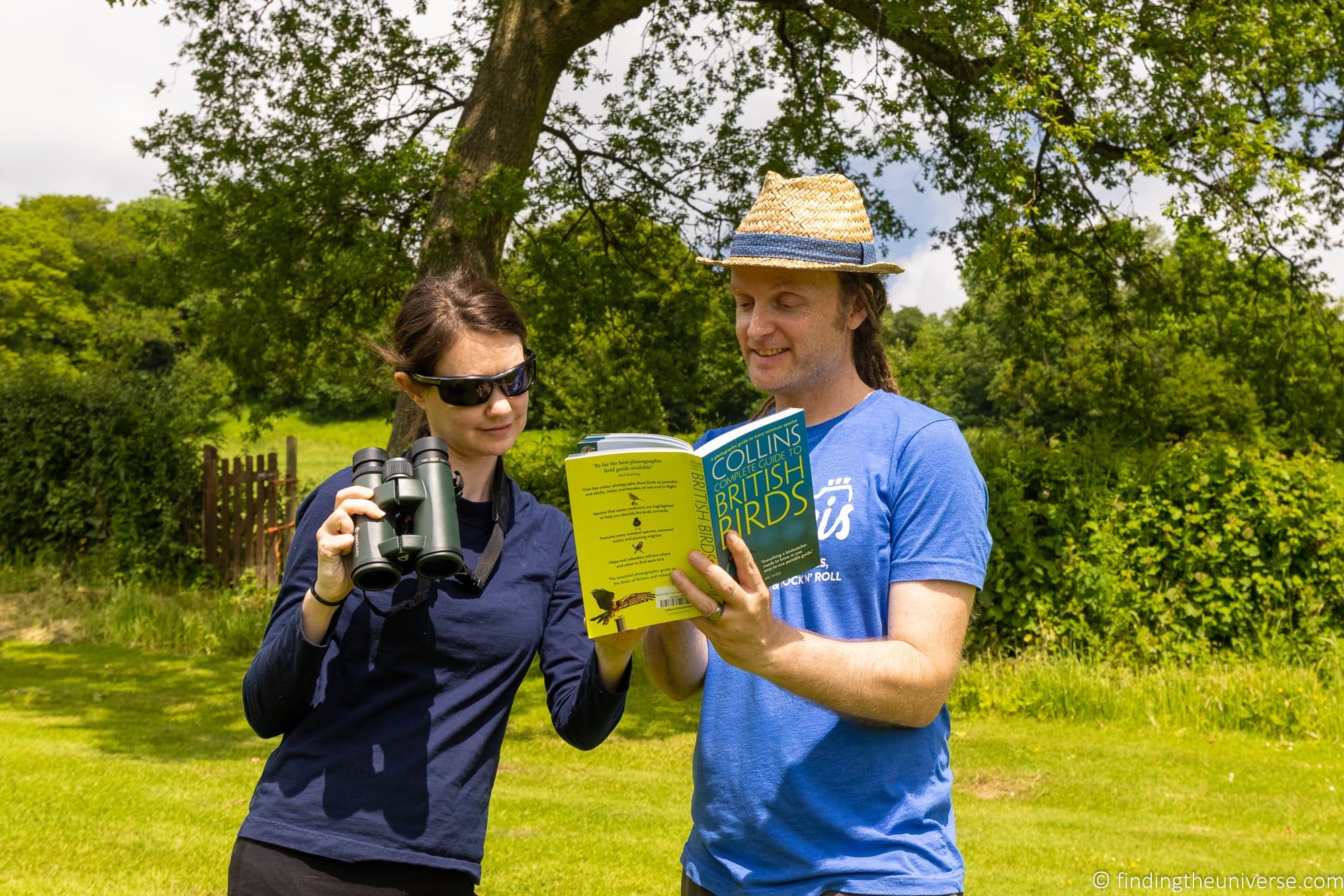 Couple looking at bird book