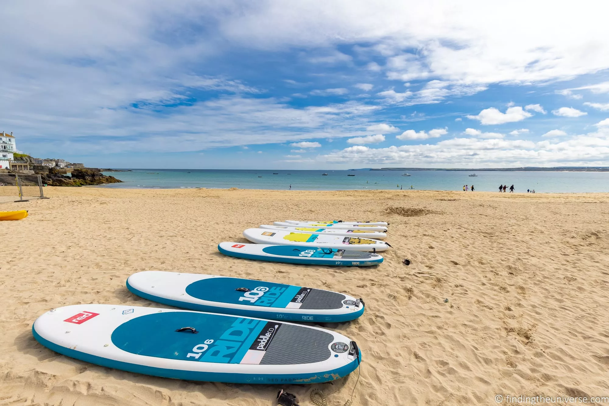 Stand-up paddleboarding on calm water in Cornwall
