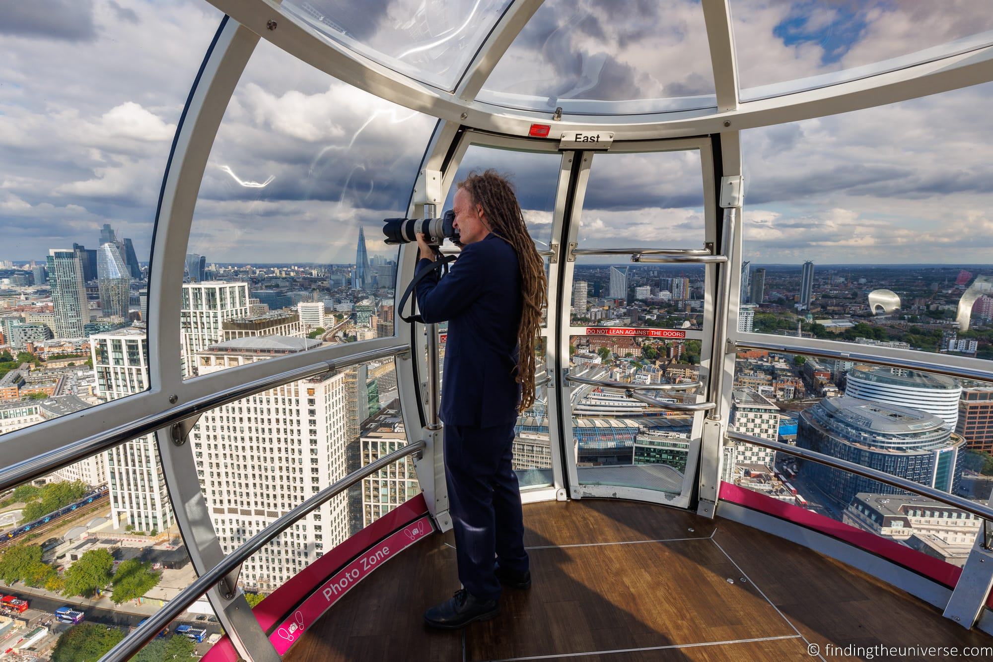 Laurence photographing from inside London Eye