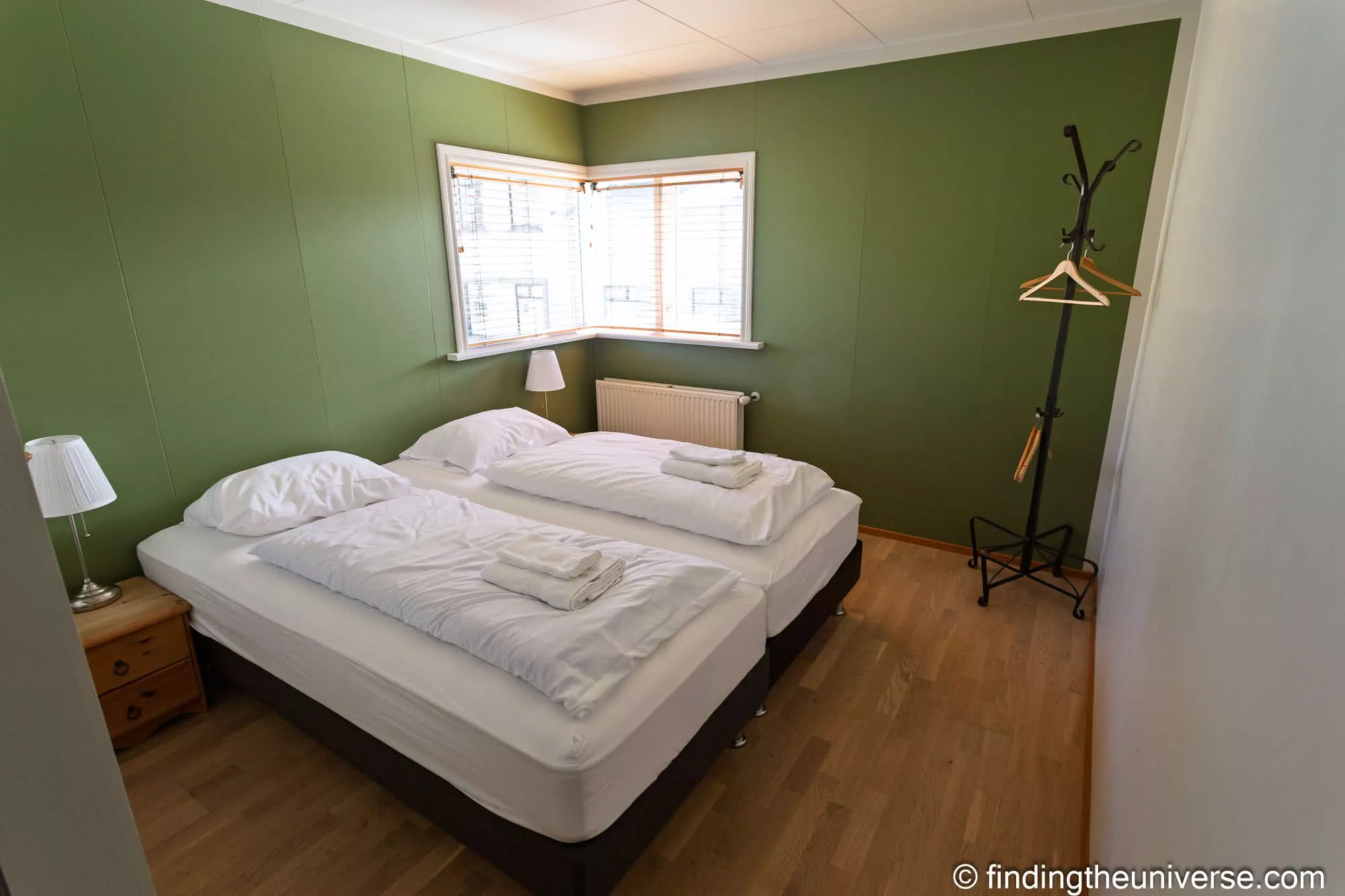 Guest room at the Fisherman Guesthouse, with folded towels on the bed