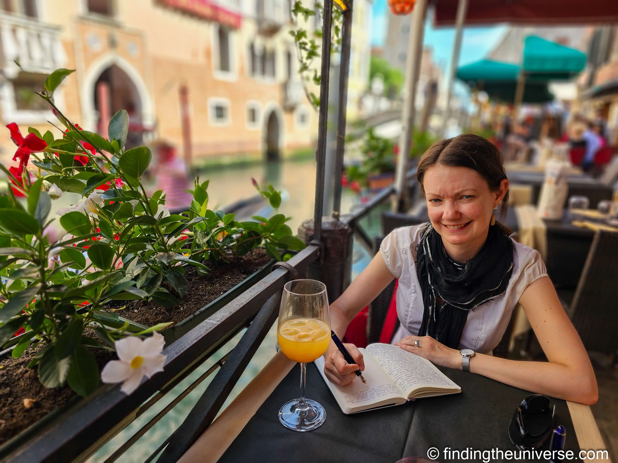 Jess writing in her journal in Venice