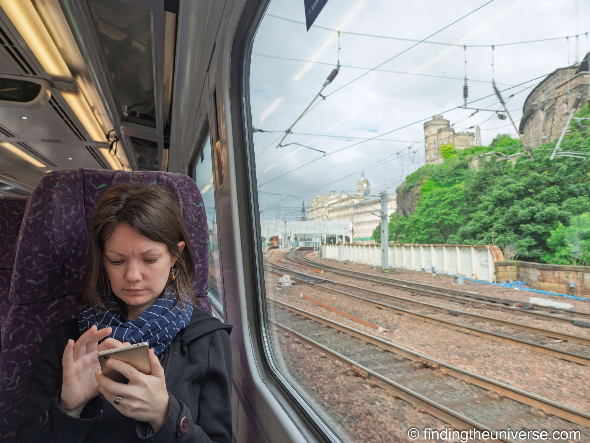 Jess using phone by Laurence Norah