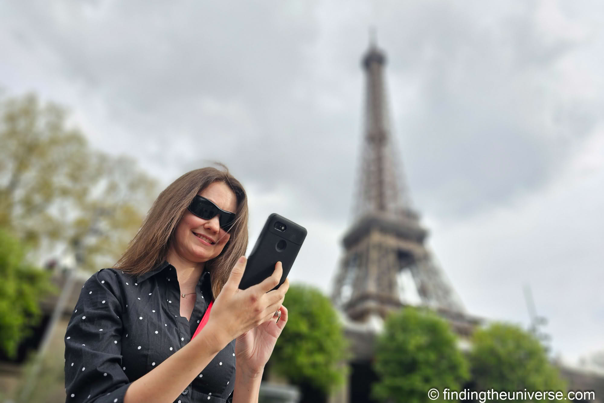 Jess using phone in Paris by_