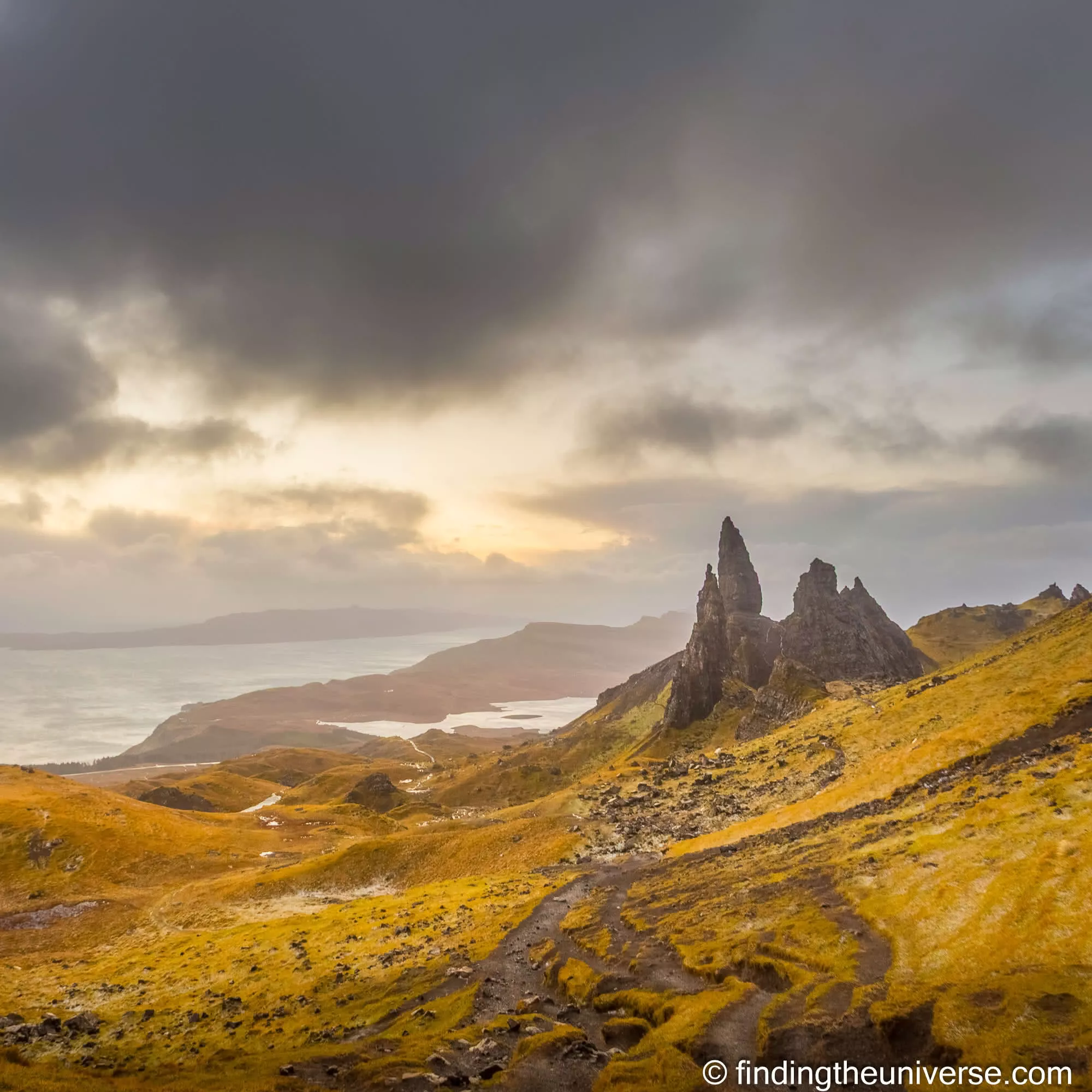The Old Man of Storr rock pinnacle on the Isle of Skye with golden light breaking through cloud