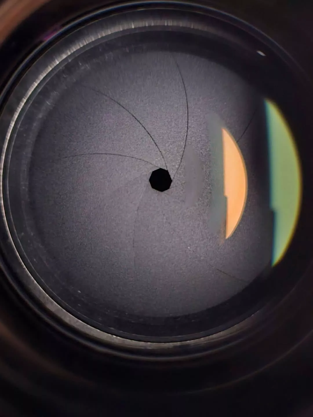 The same lens closed to f/32, the aperture now a tiny pinhole