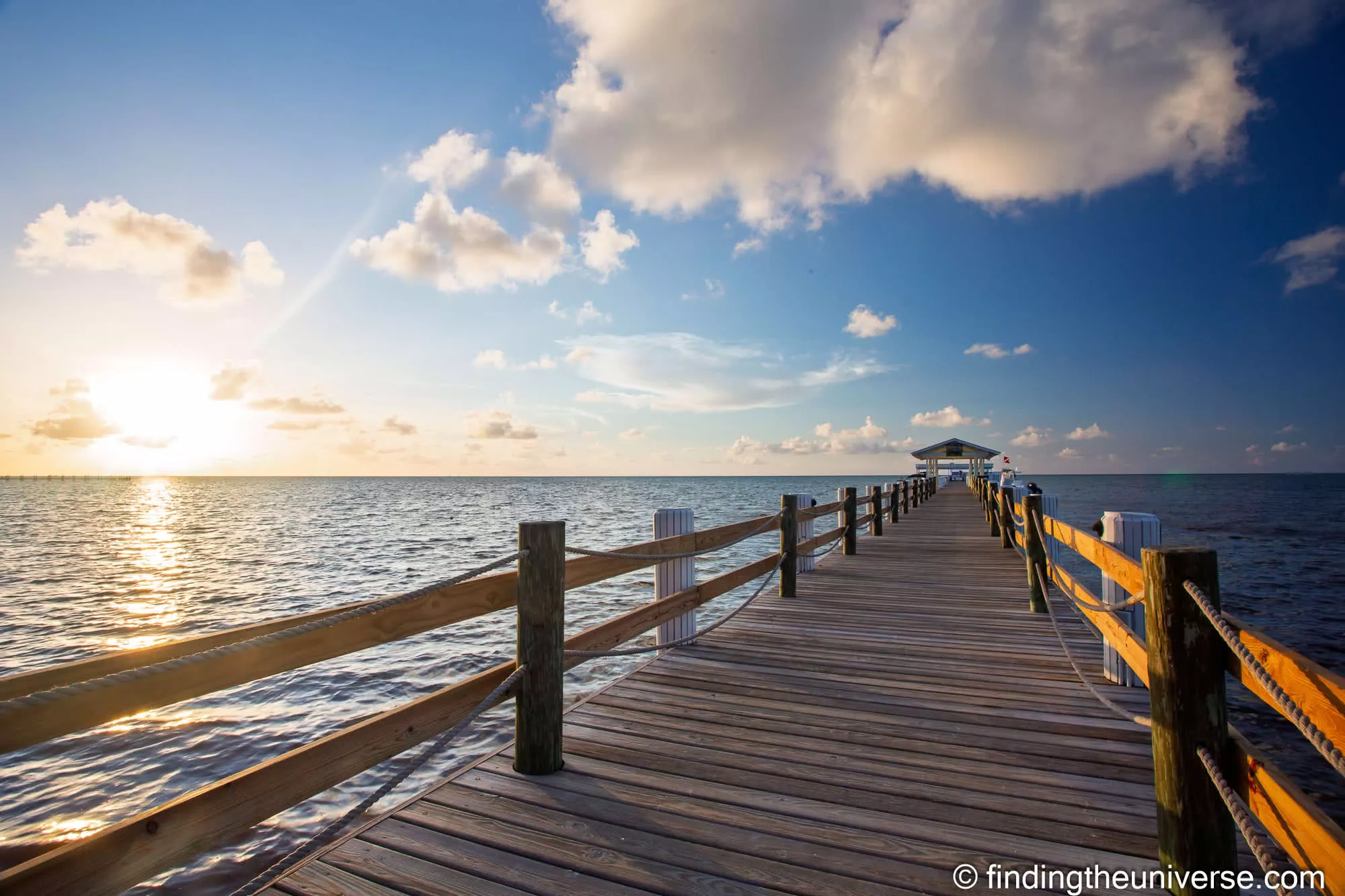 sunrise over the pier Florida Keys by Laurence Norah