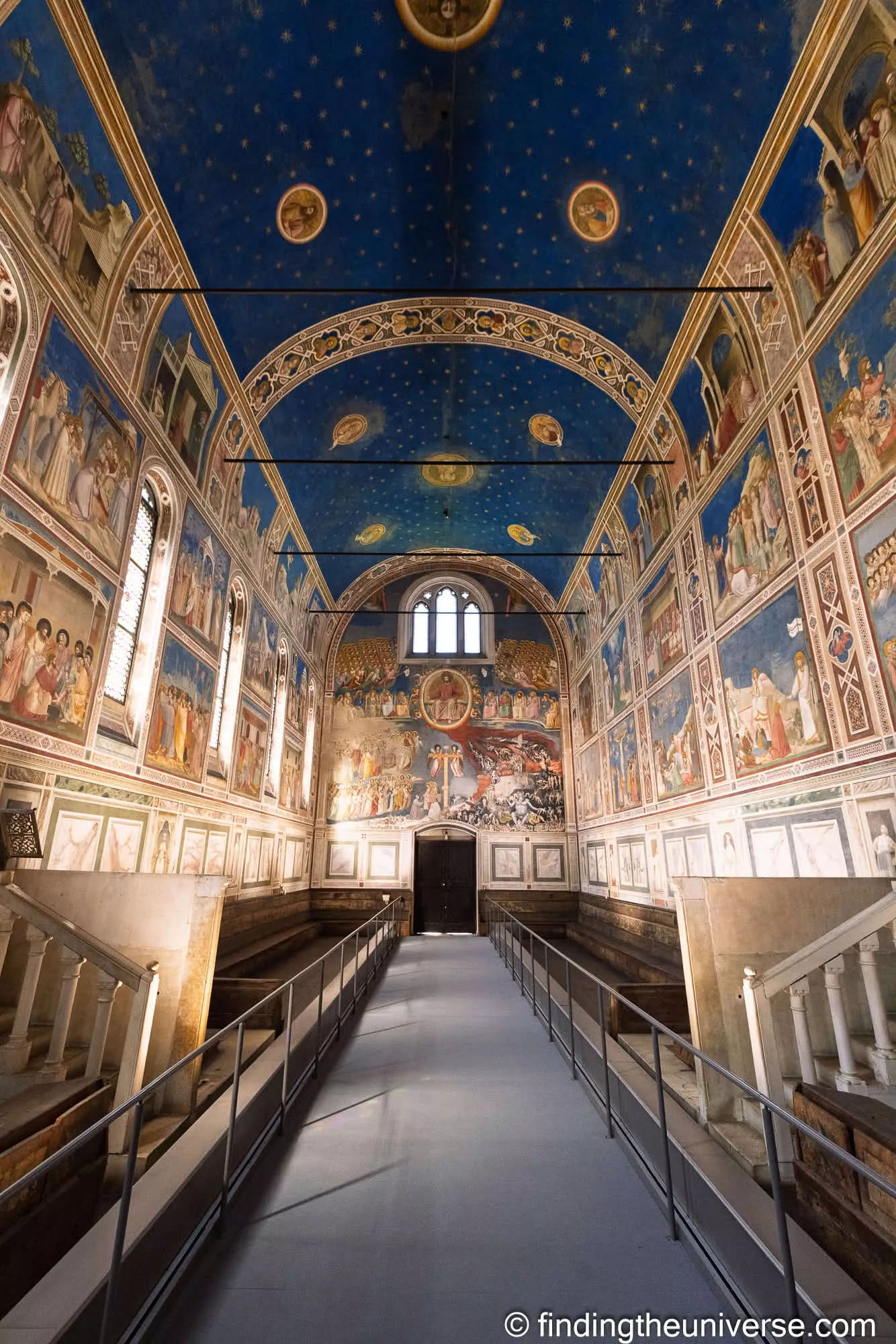 The blue starry ceiling and frescoed nave of the Scrovegni Chapel in Padua