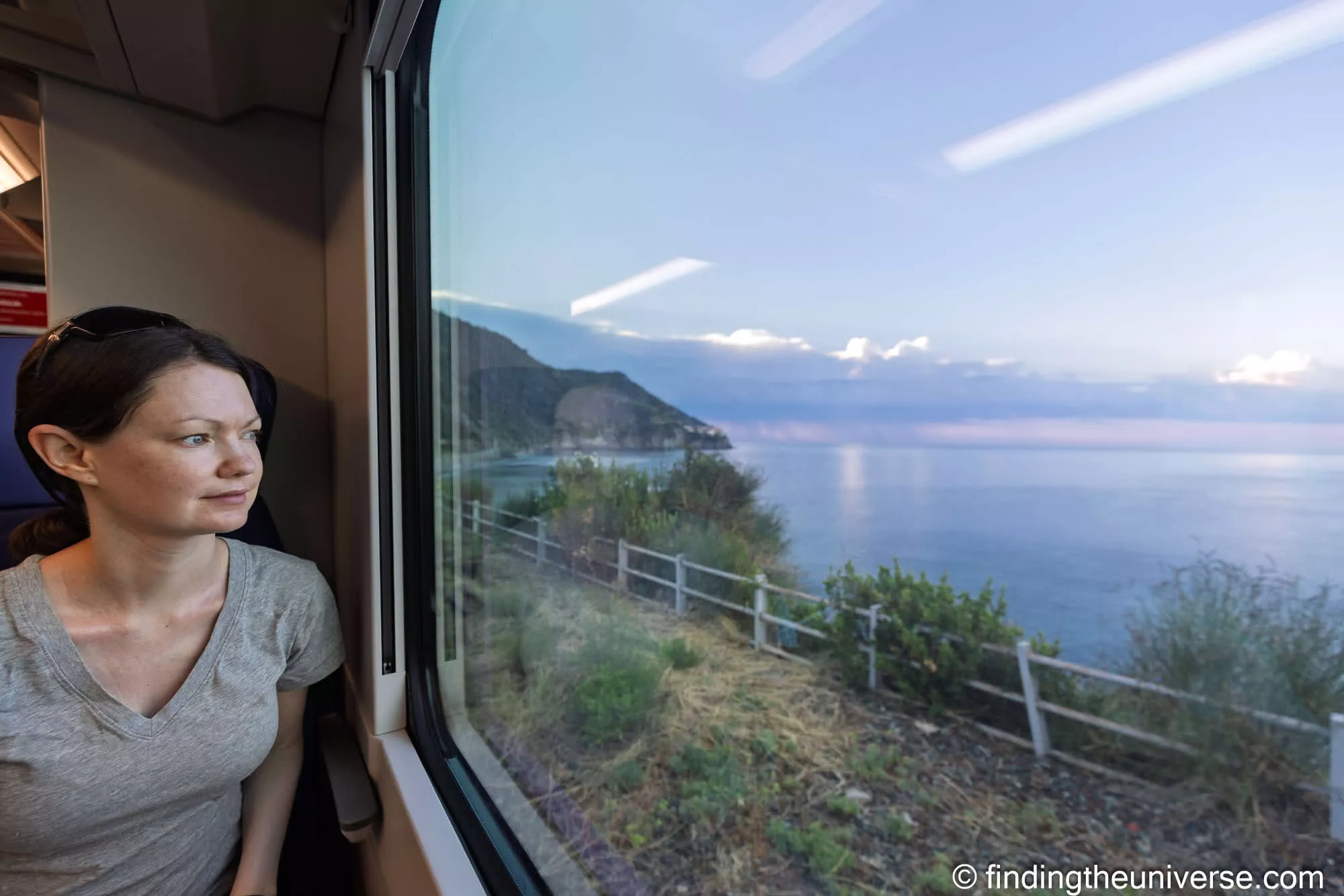 Jess on the Cinque Terre Express train watching the coast go by