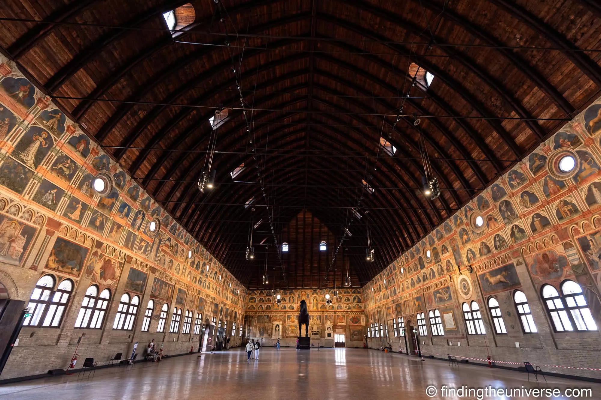 The vast frescoed medieval hall of Il Salone, with its curved wooden roof, inside the Palazzo della Ragione in Padua