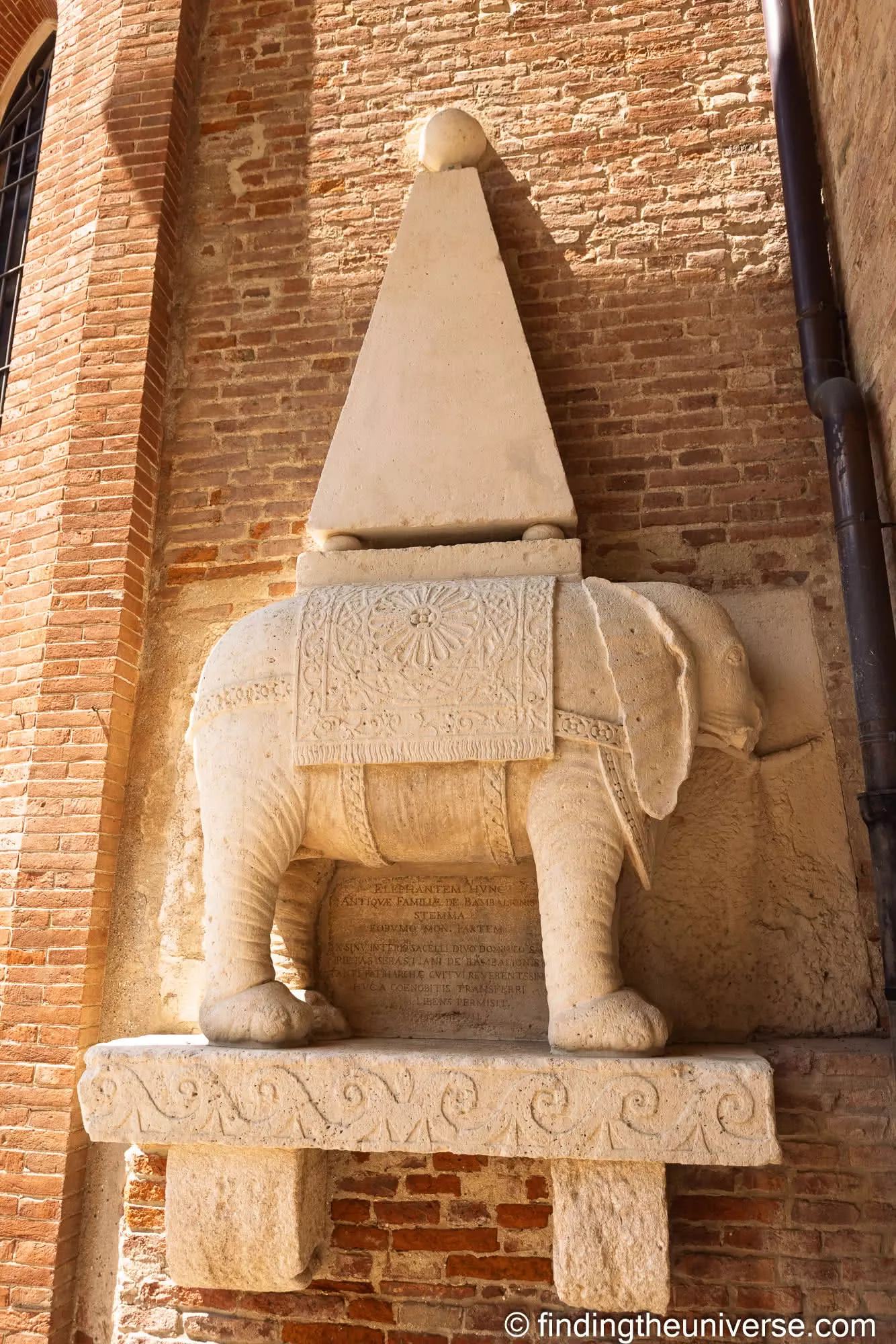 Stone elephant-and-pyramid sculpture outside the church of Santa Corona in Vicenza